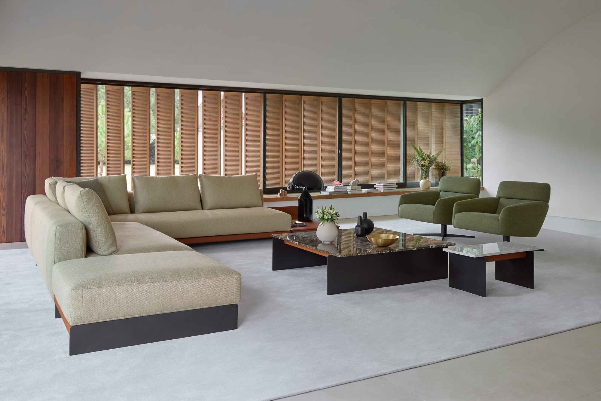 Axis coffee and side tables and Sledd sofa system designed by Mario Ruiz for Joquer