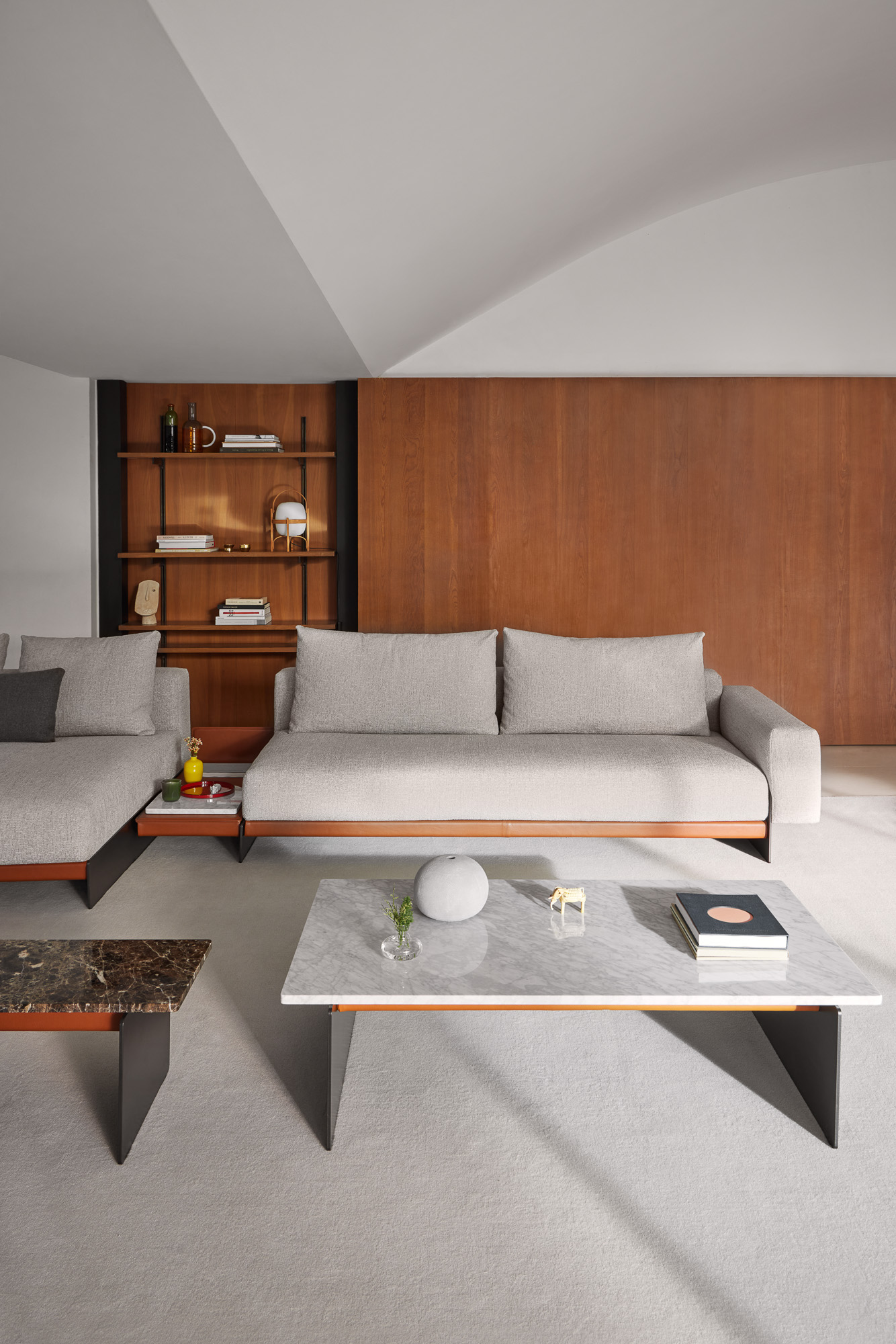 Axis coffee and side tables and Sledd sofa system designed by Mario Ruiz for Joquer