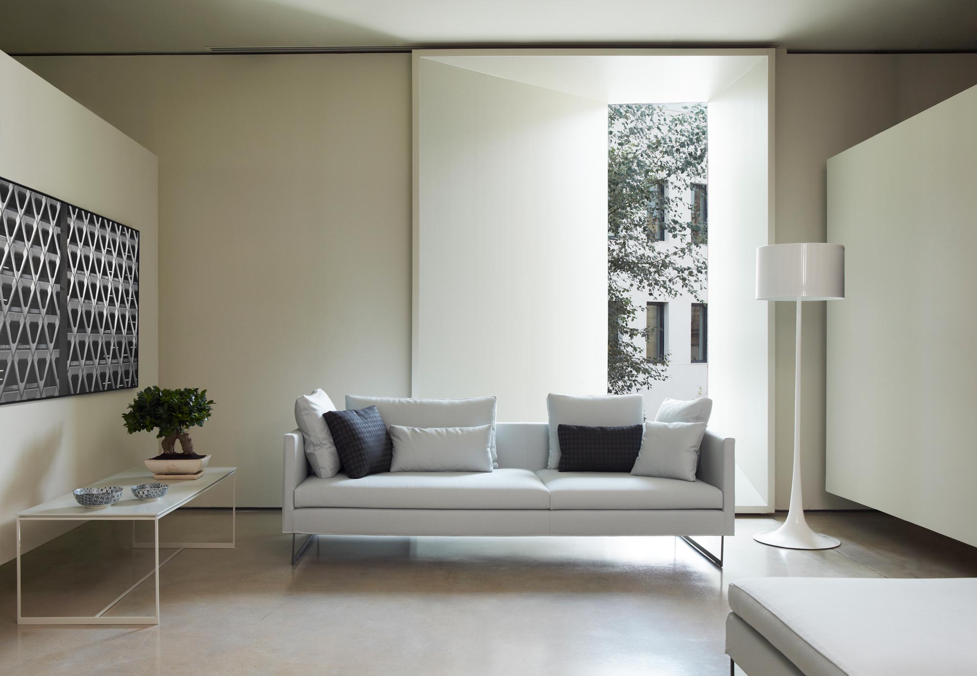 Deck Sofa with fabric exterior and connected legs by Mario Ruiz for Joquer