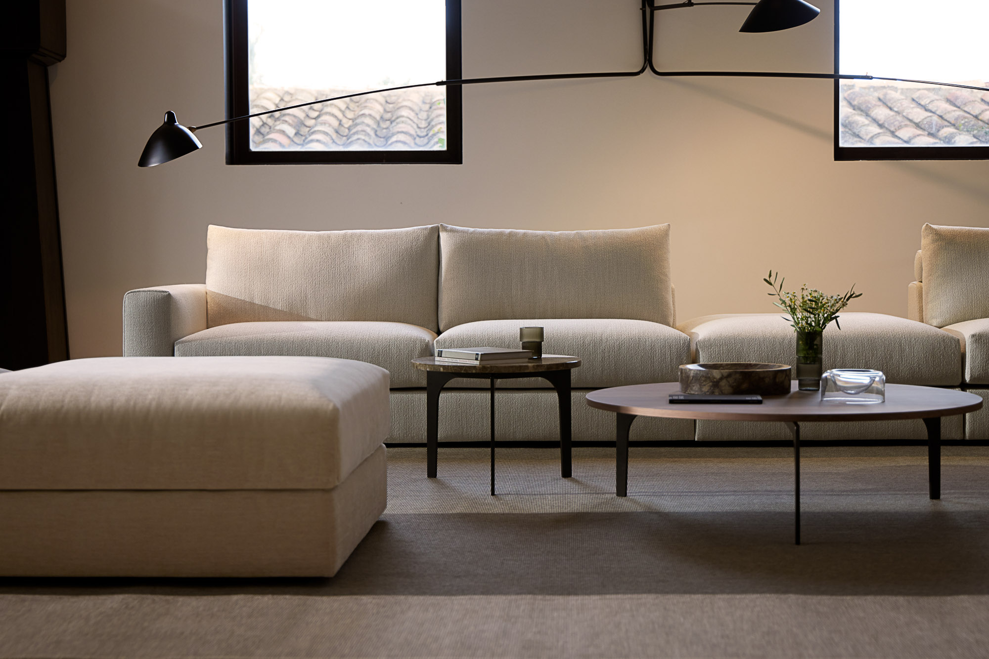 Front sofa system and Padi occasional tables designed by Mario Ruiz for Joquer