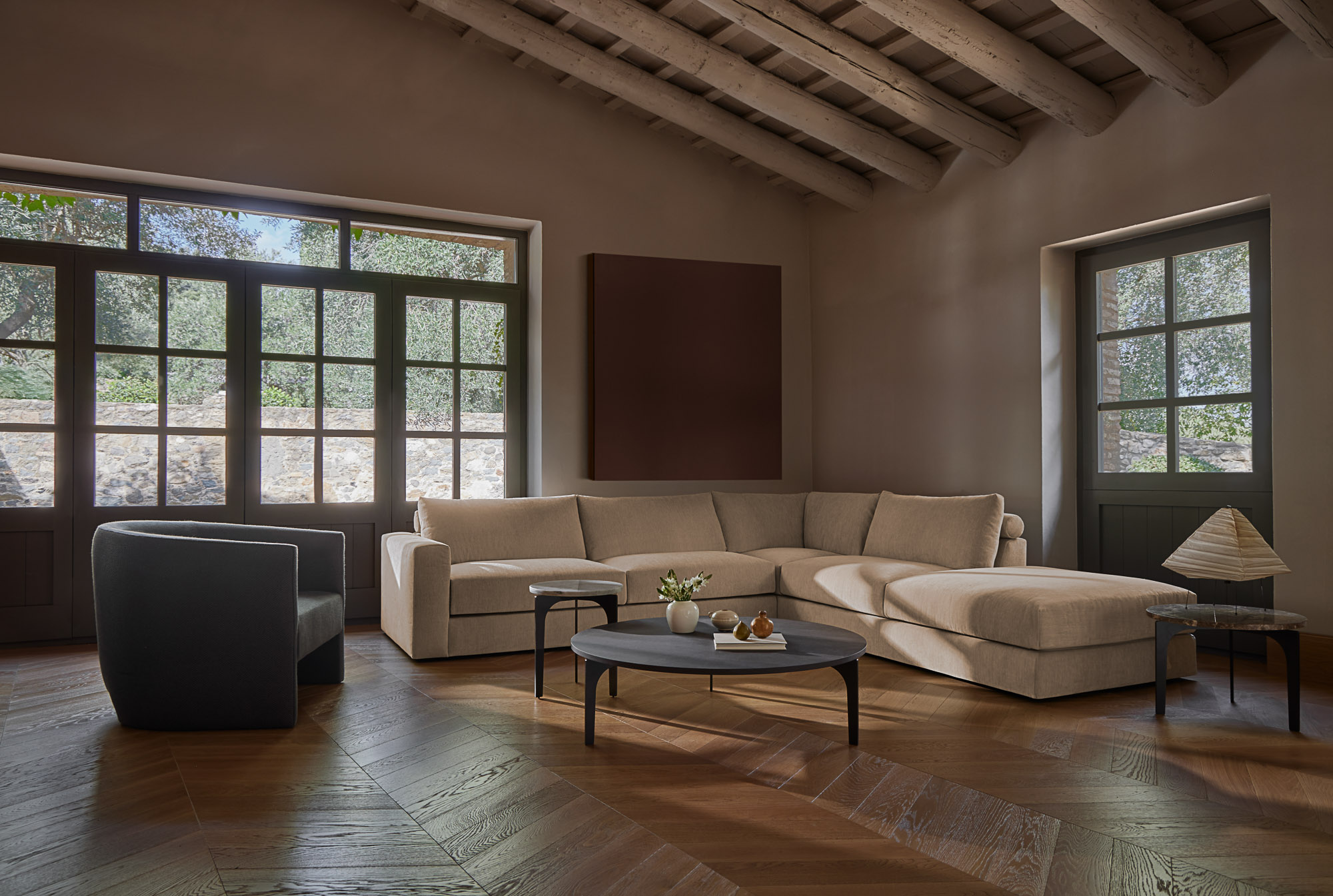 Front sofa system, Flow armchair and Padi occasional tables designed by Mario Ruiz for Joquer