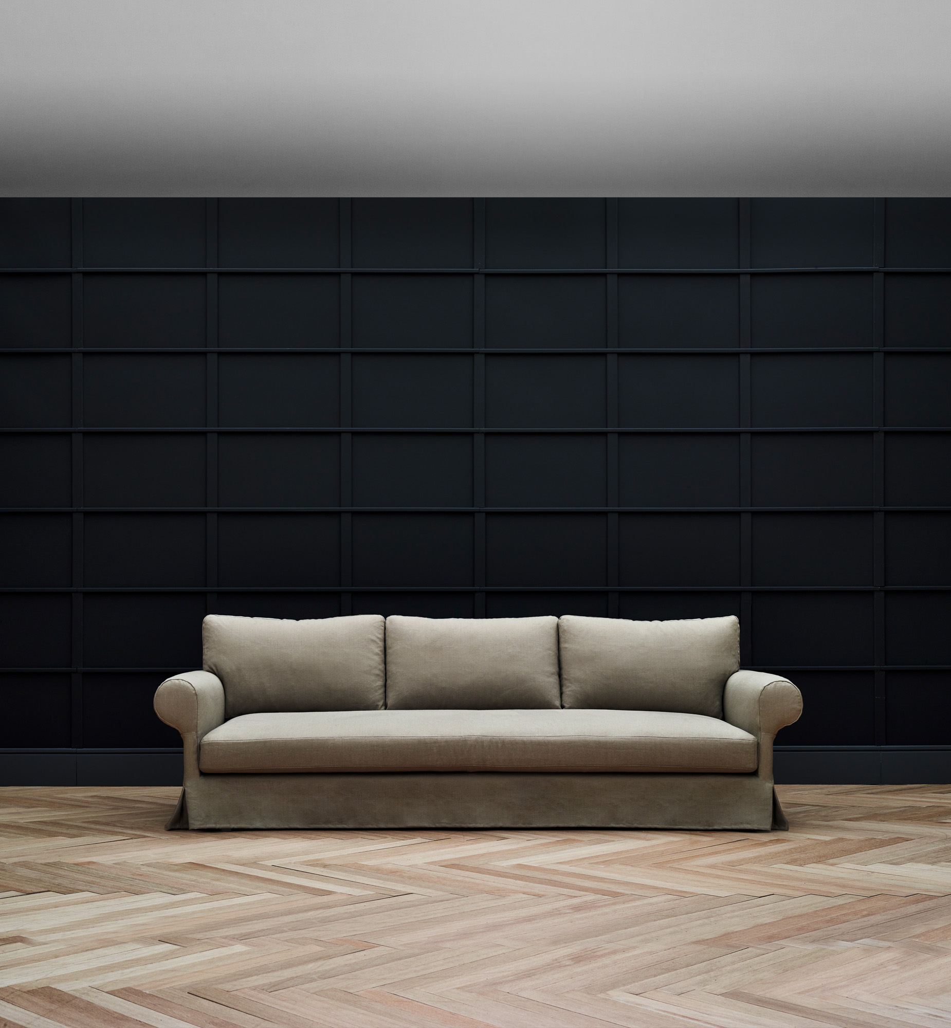 Magnus skirted sofa designed by Mario Ruiz for Joquer.