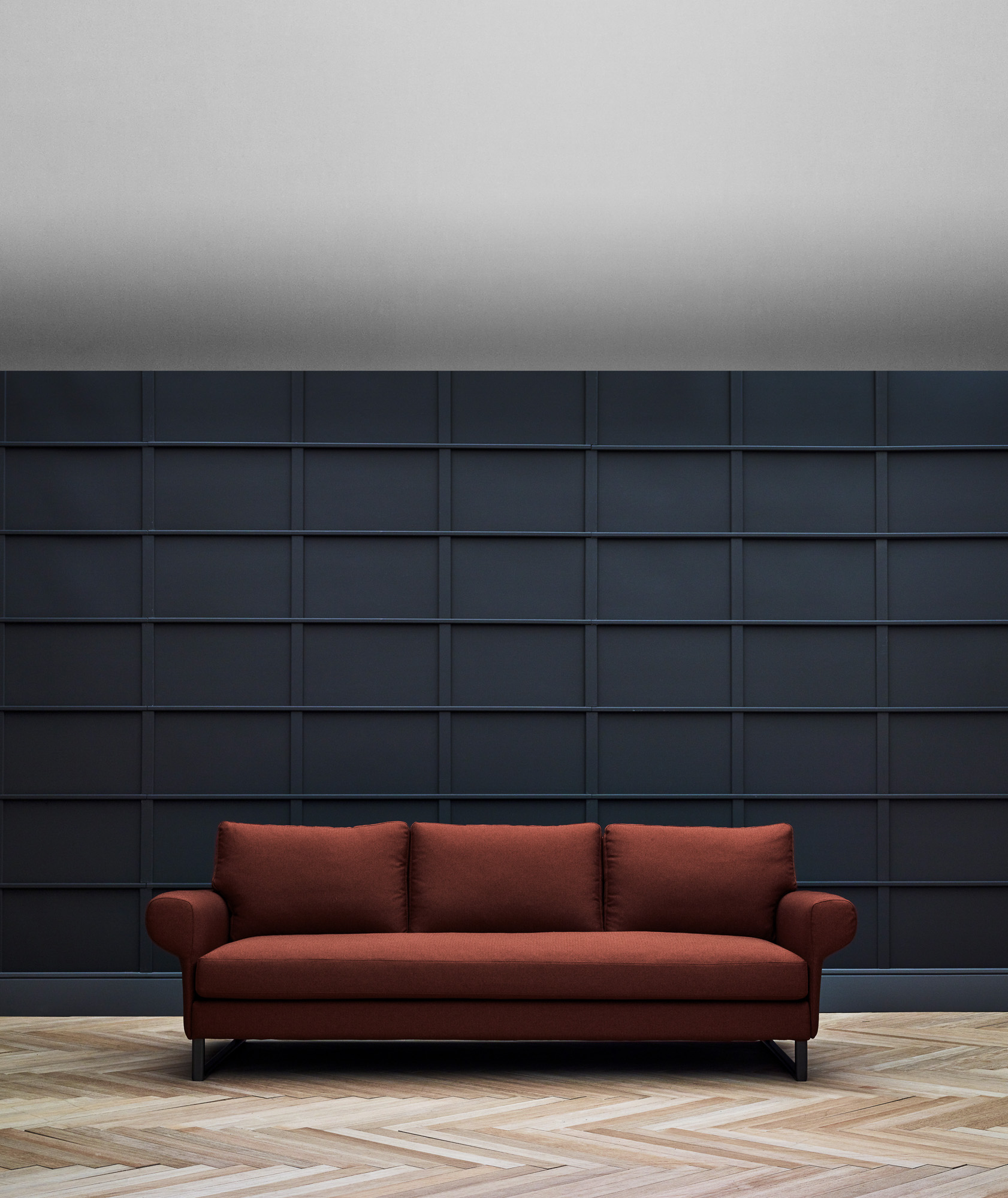 Magnus sofa. Suspended base version on U-shaped metal bases.