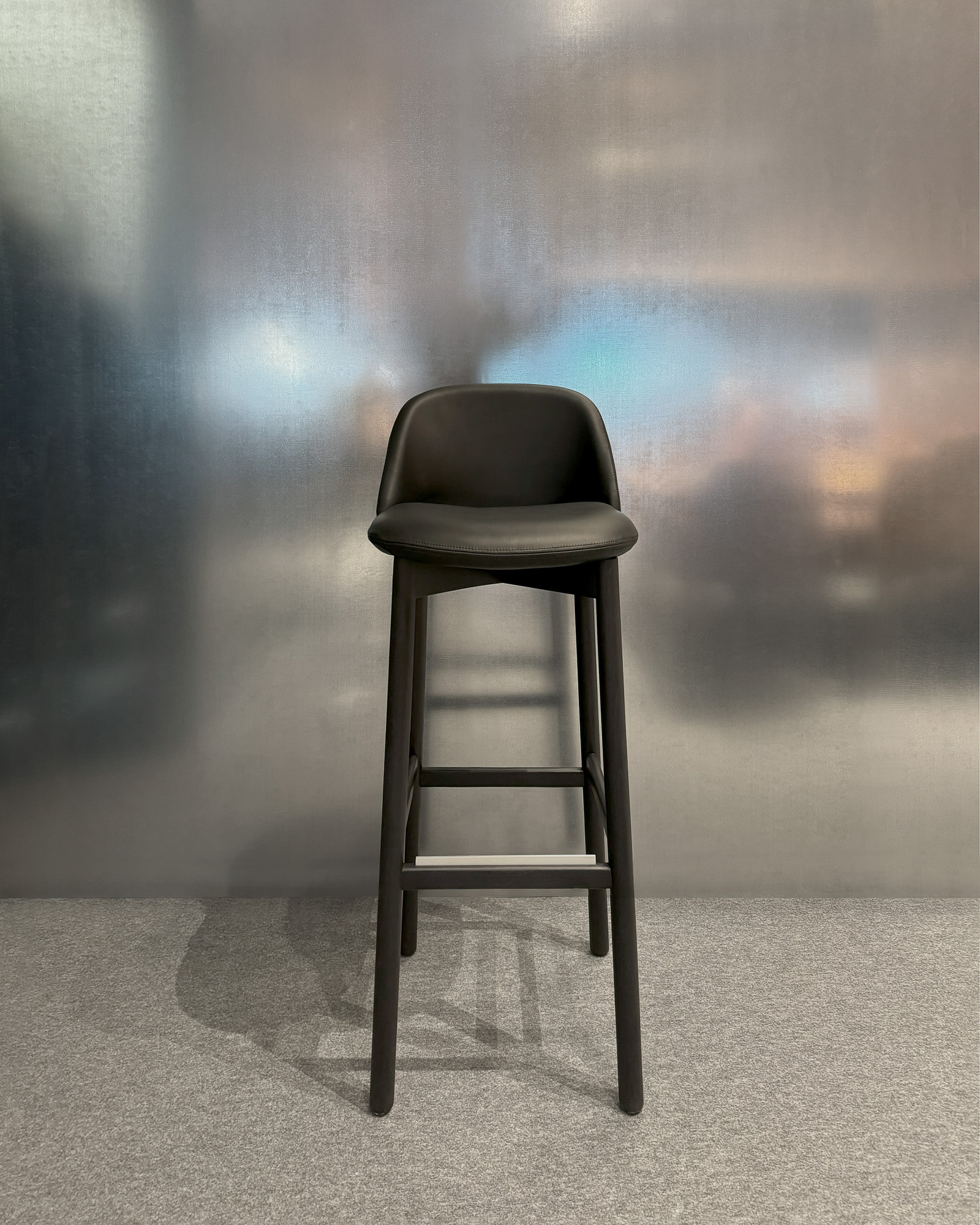 Nara barstool with solid wood structure designed by Mario Ruiz for Capdell