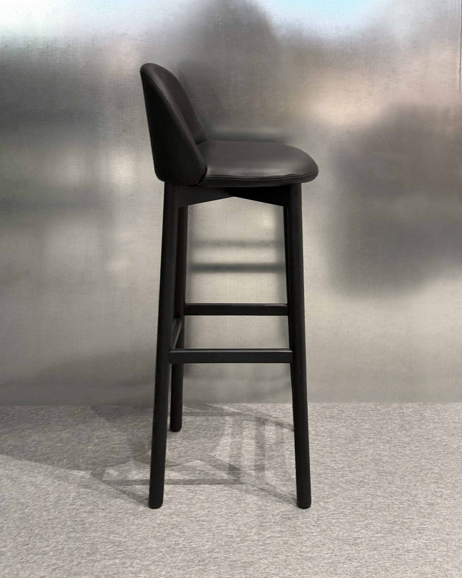 Nara barstool with solid wood structure designed by Mario Ruiz for Capdell