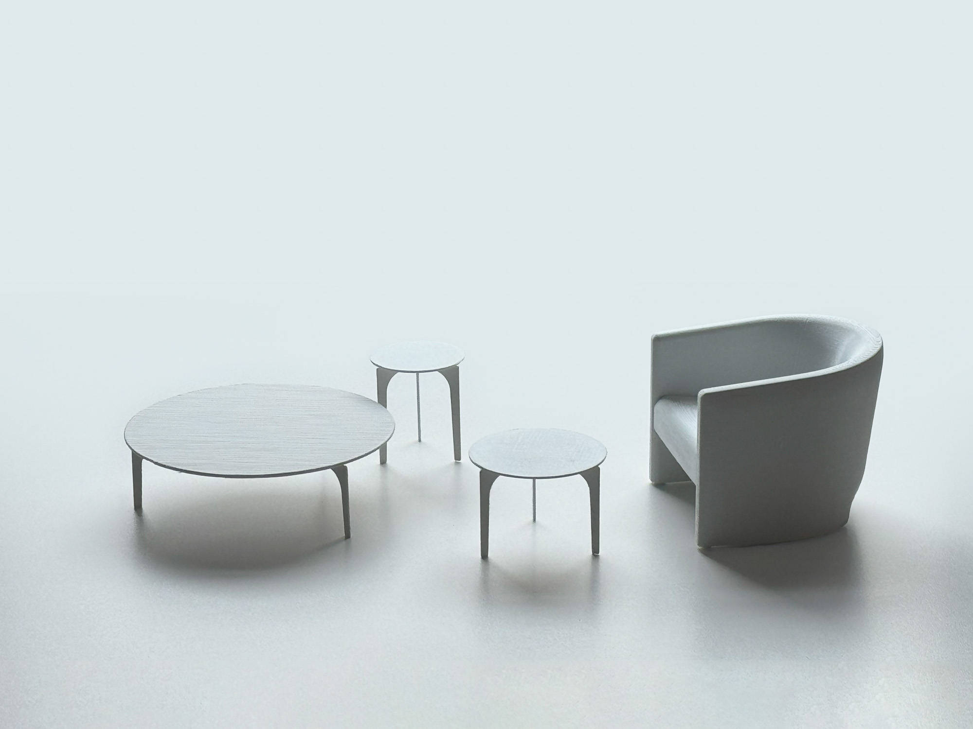 3D printed models of Padi coffee tables and Flow lounge chair designed by Mario Ruiz for Joquer