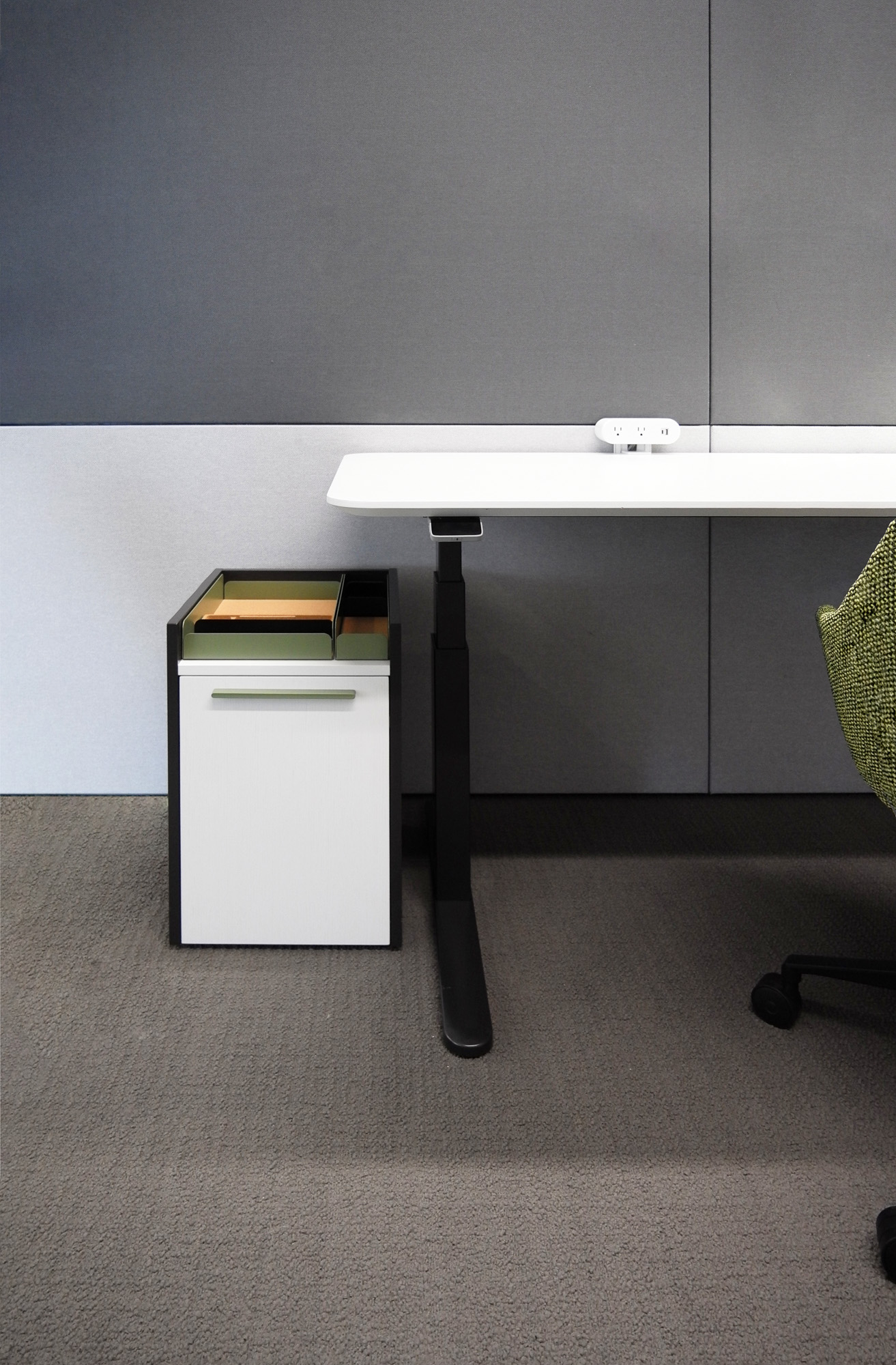 Height adjustable desk and cabinet from the Emote private office collection by Mario Ruiz