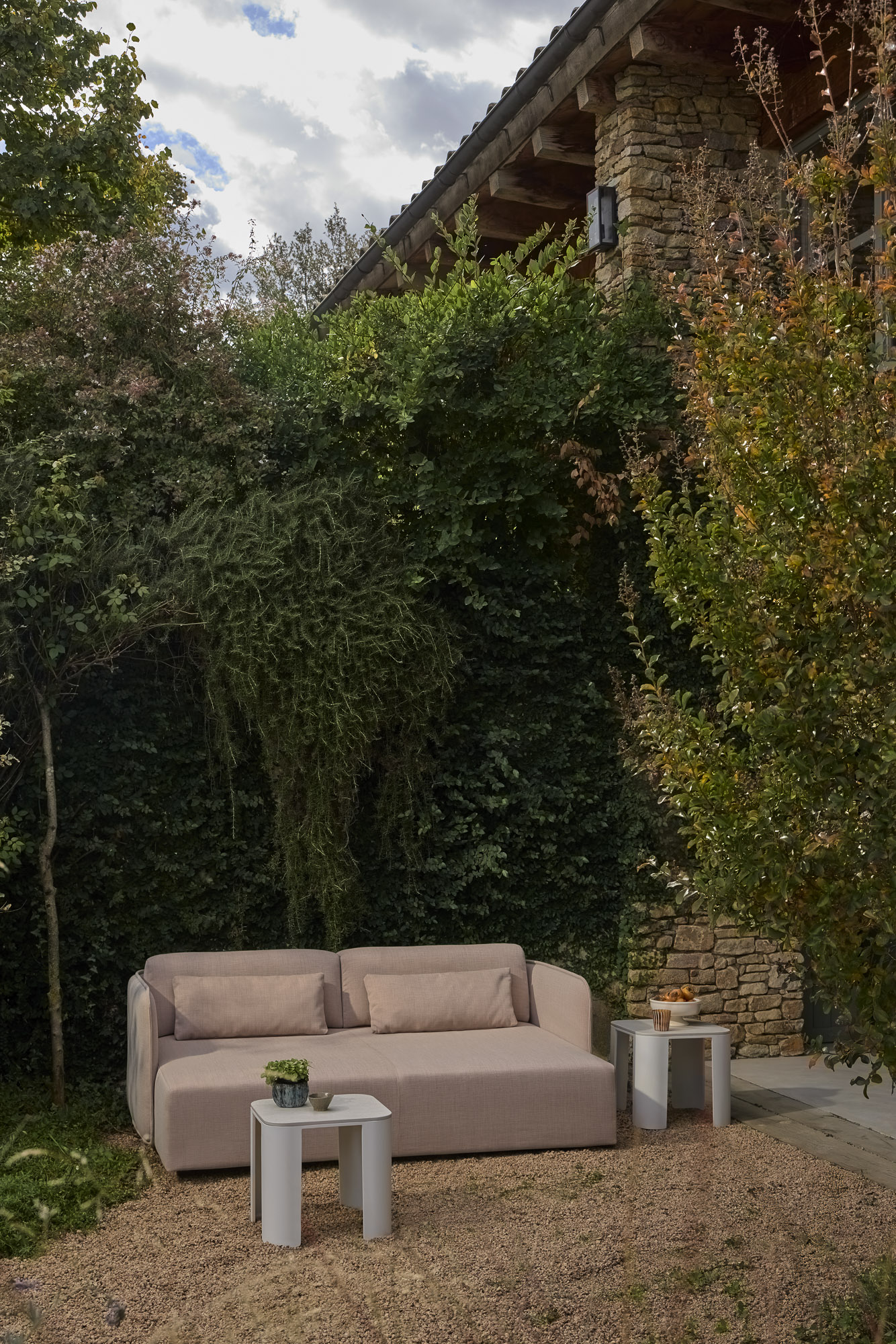 Serene Outdoor daybed and Bene tables designed by Mario Ruiz
