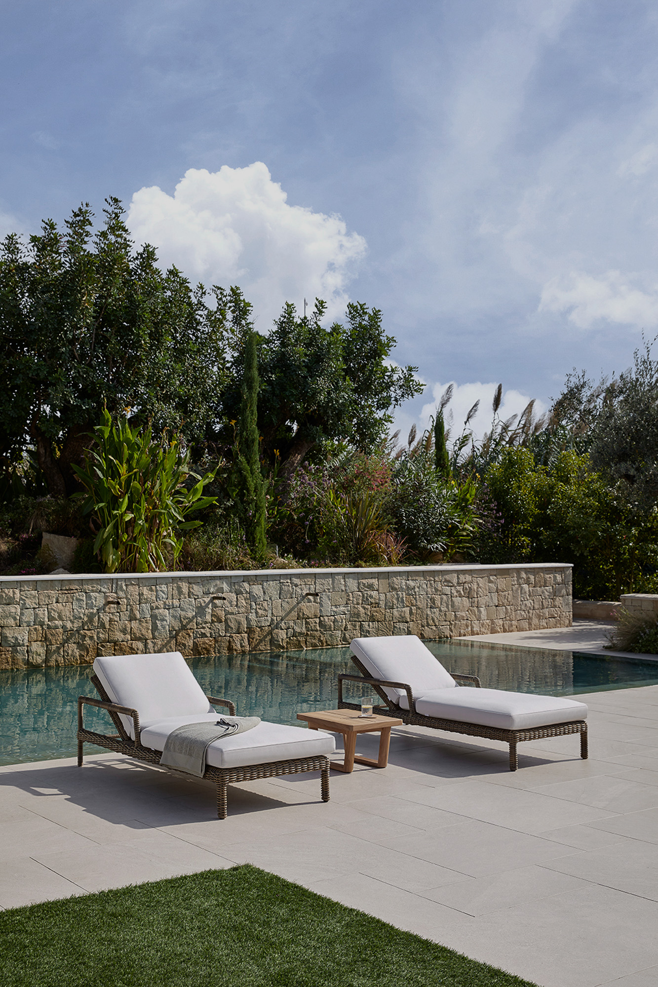 Heritage Outdoor Collection sunbeds and poolside table designed by Mario Ruiz for POINT