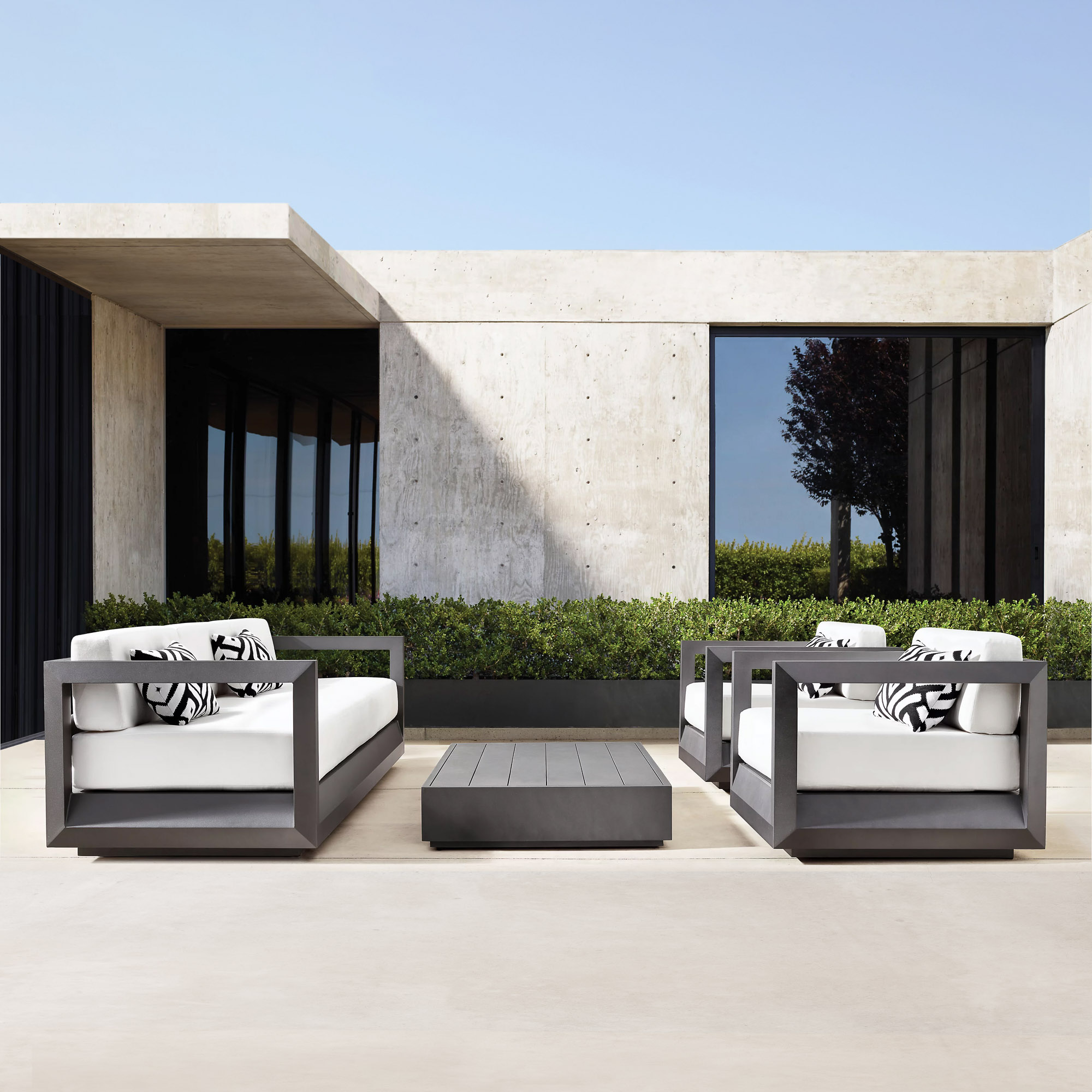 Paloma aluminum outdoor sofa and lounge chairs by Mario Ruiz for Restoration Hardware