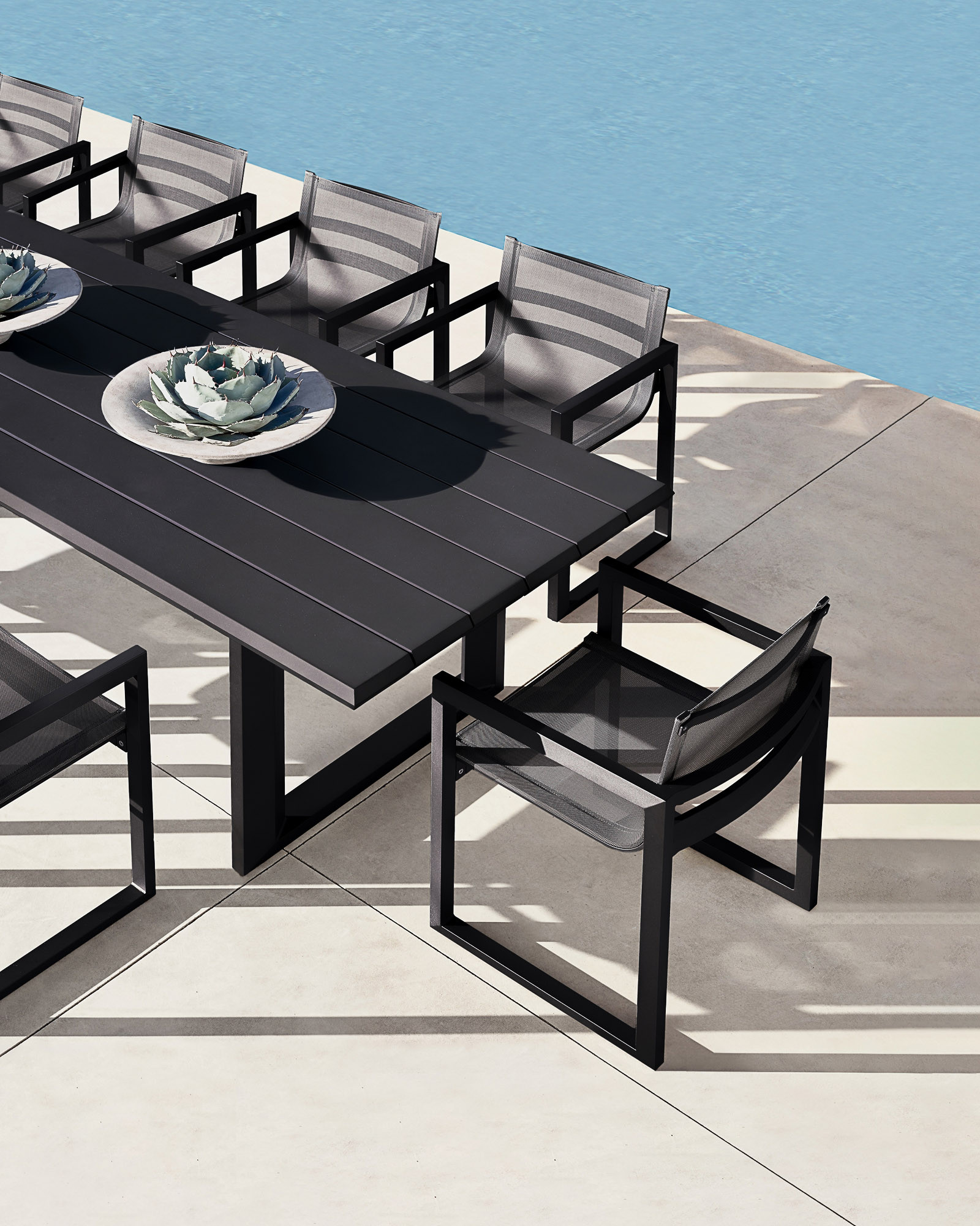 Paloma aluminum and mesh dining set designed by Mario Ruiz for Restoration Hardware