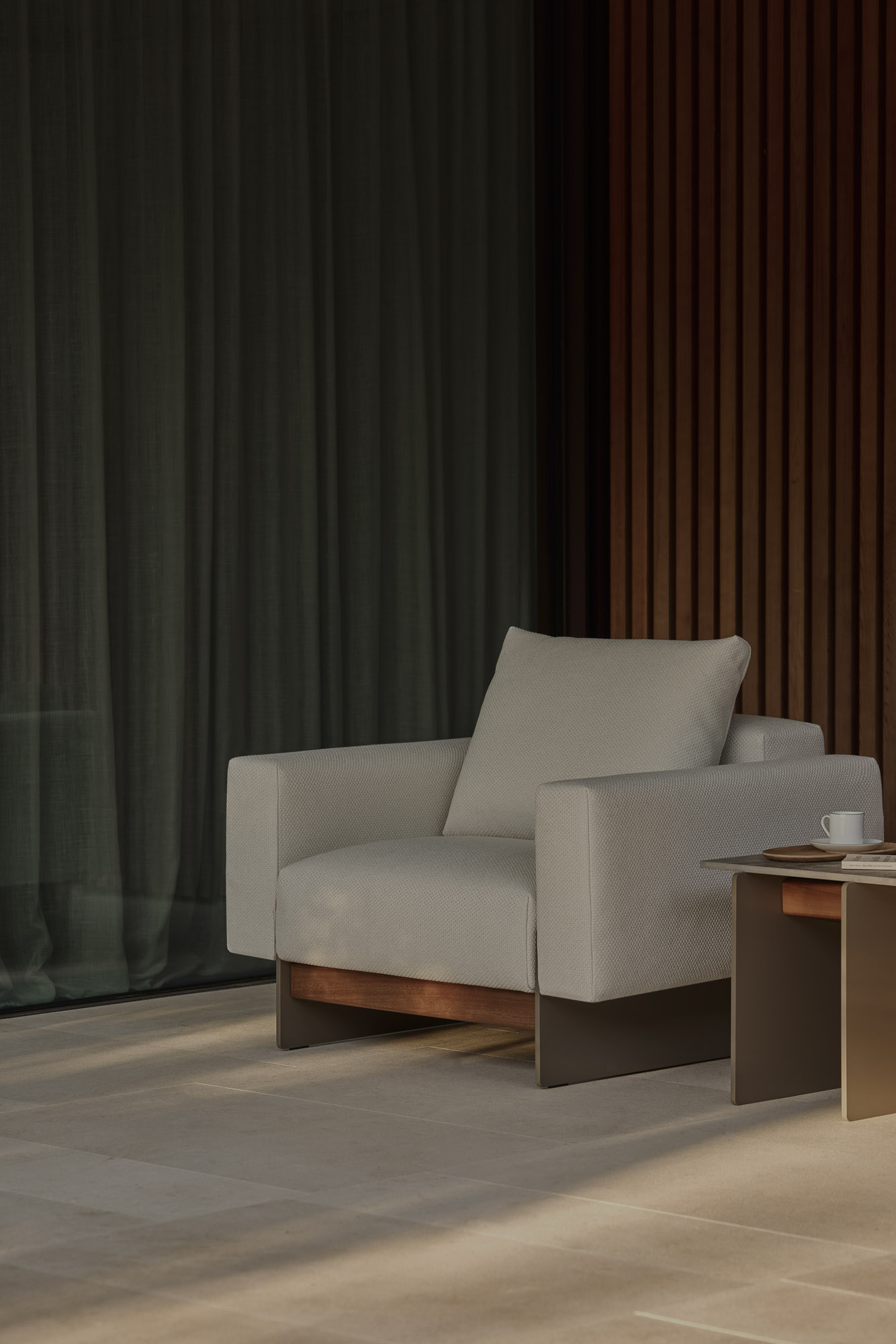 Sledd outdoor lounge chair and Axis Outdoor side table designed by Mario Ruiz for Joquer