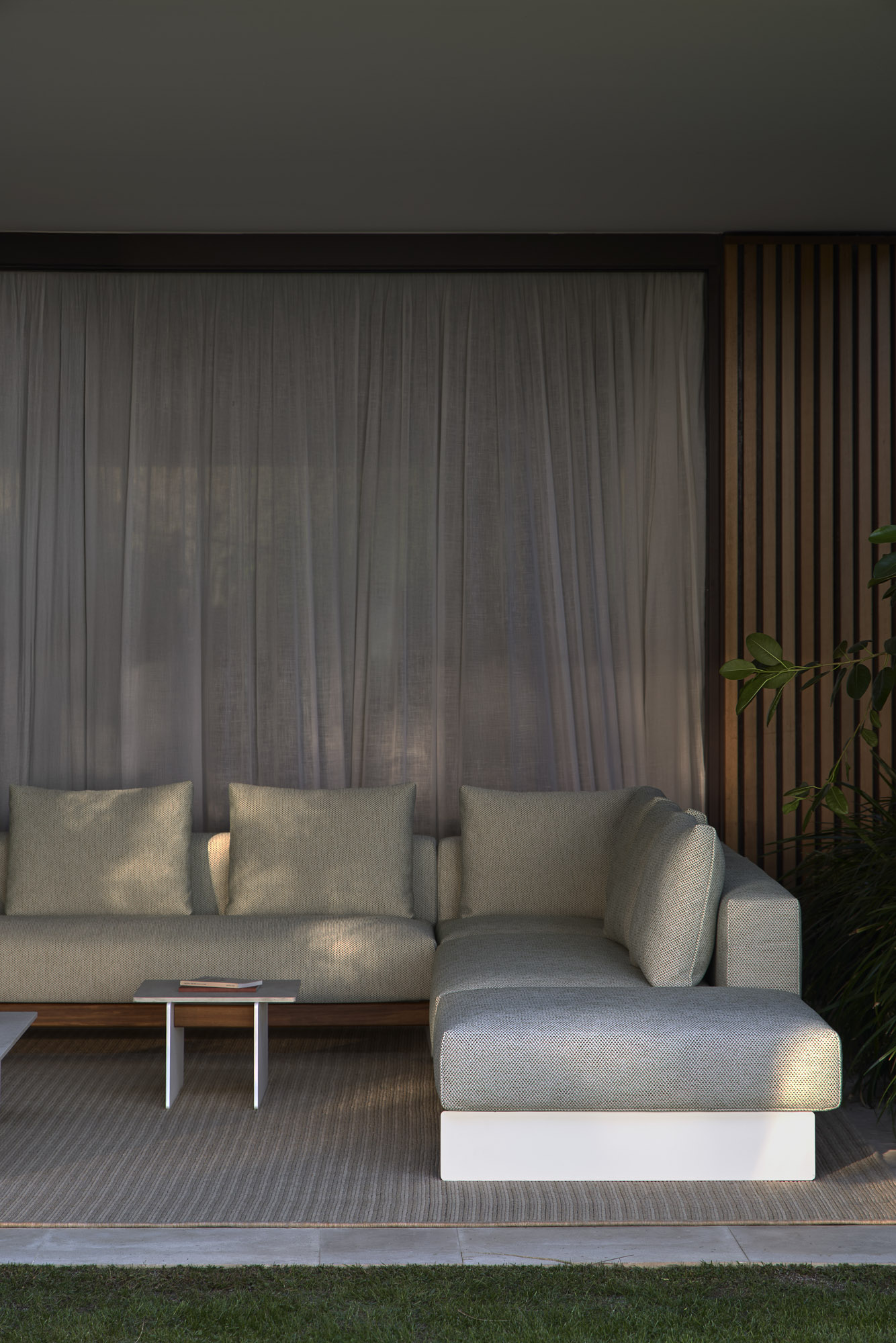 Sledd outdoor sofa system and Axis Outdoor table designed by Mario Ruiz for Joquer