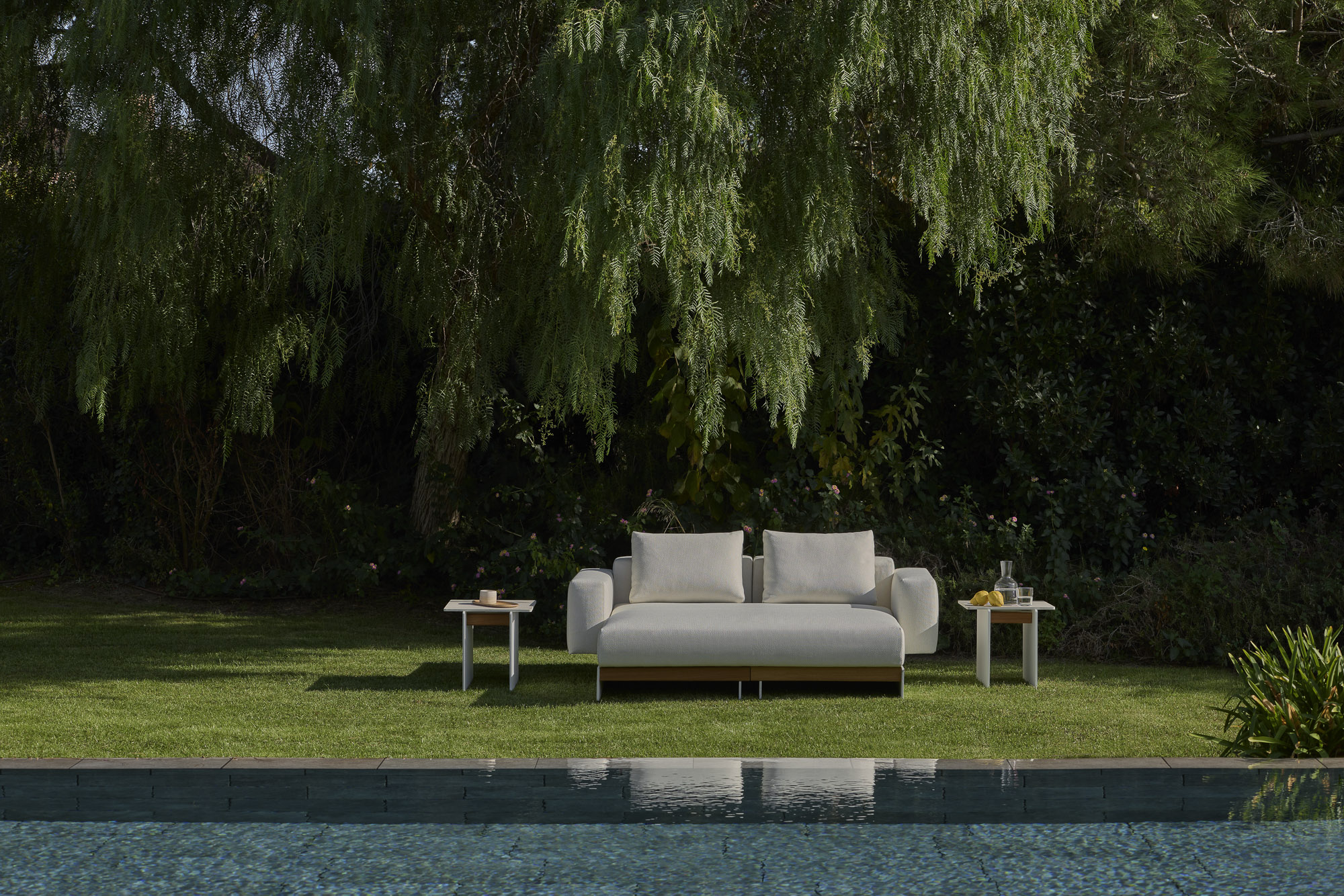 Sledd outdoor daybed and Axis Outdoor table designed by Mario Ruiz for Joquer