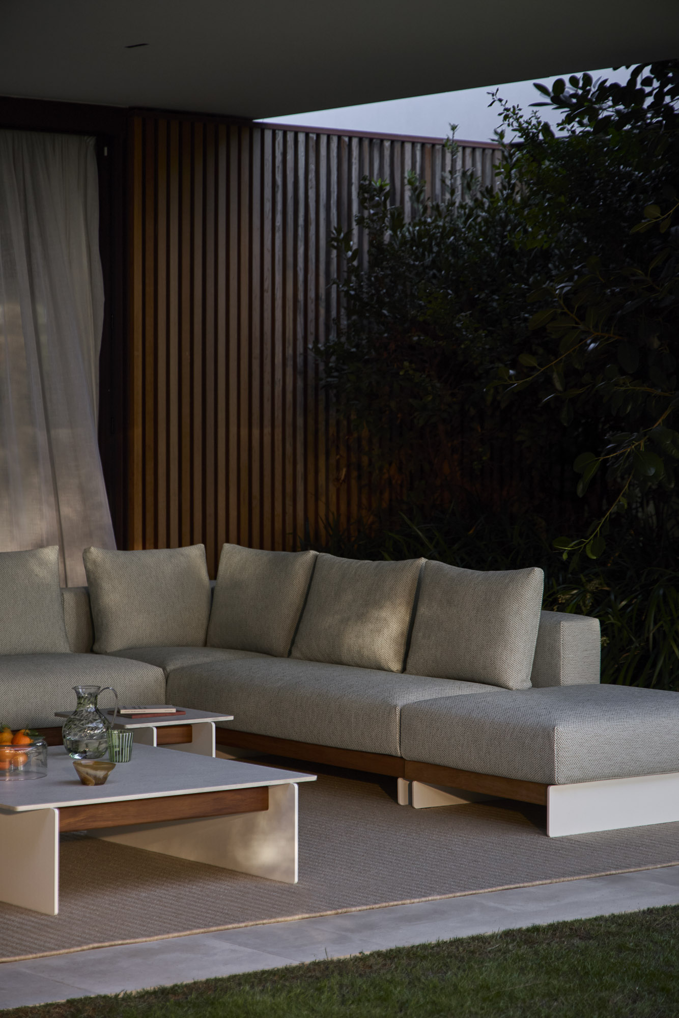 Sledd outdoor sofa system and Axis Outdoor tables designed by Mario Ruiz for Joquer